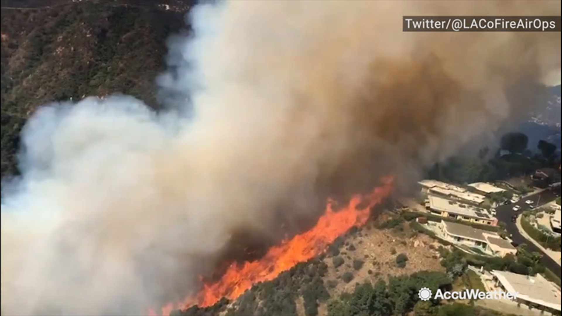 In this video, a helicopter lines up to drop water on the Palisades Fire in Los Angeles, California, on Oct. 21.