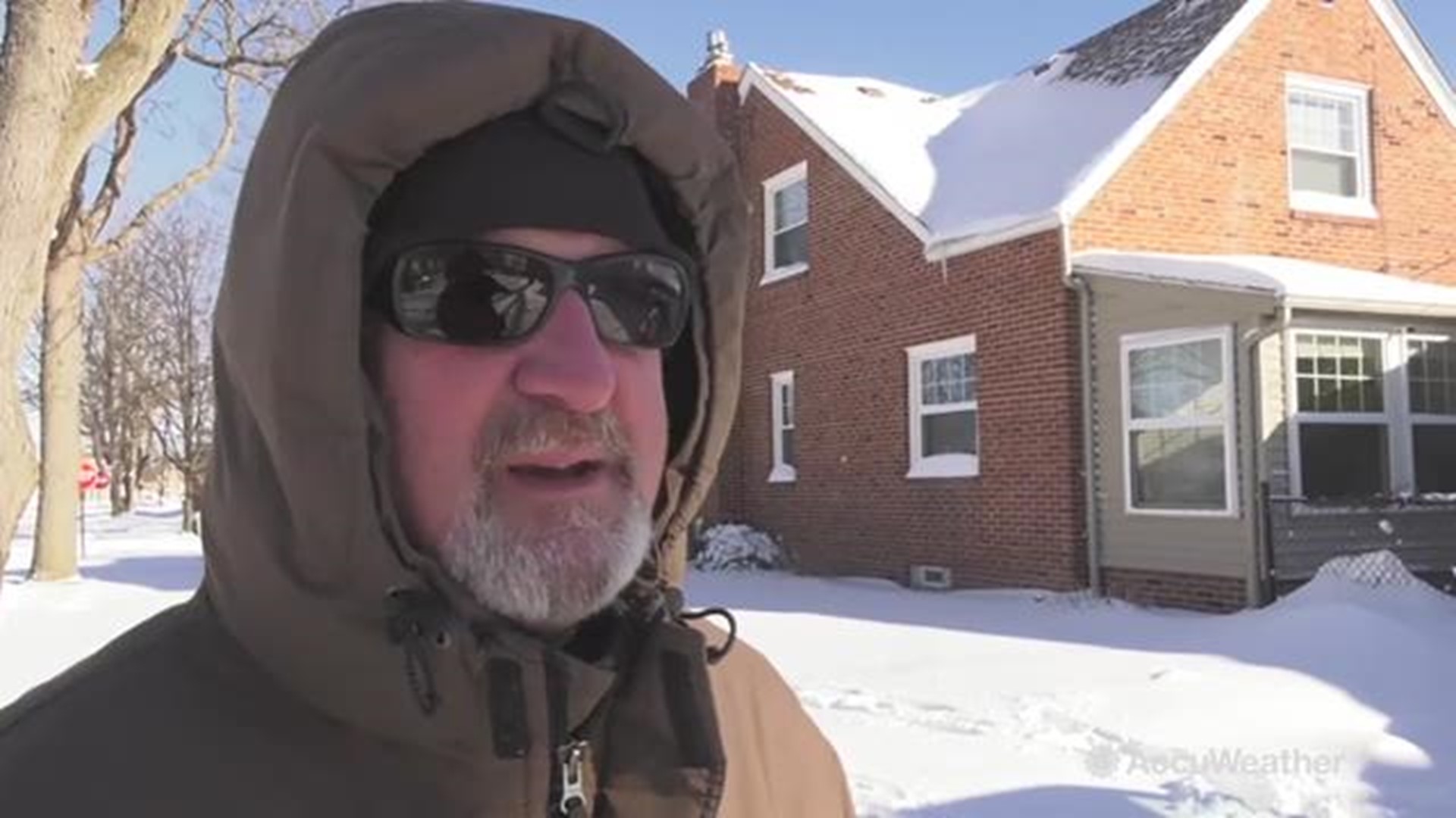 The day after a powerful winter storm swept through, residents of Toledo, Ohio begin to dig themselves out on Jan. 20.