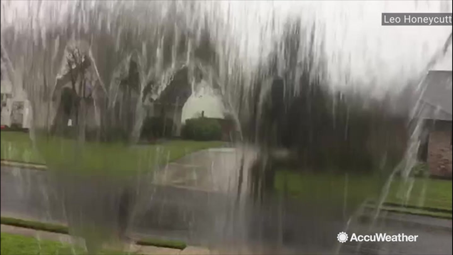 Rain comes down so hard in Baton Rouge, Louisiana, that it spills over the rain gutters on Oct. 21.