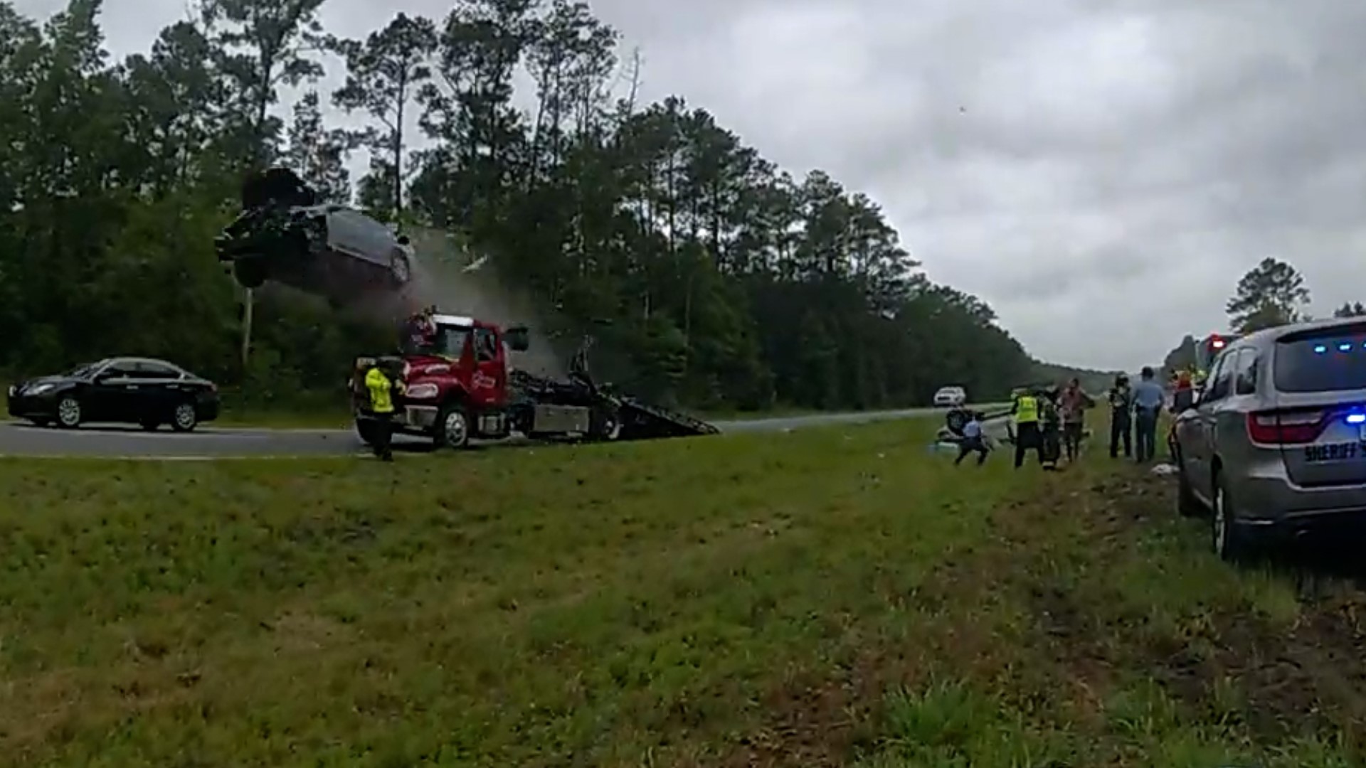 Bodycamera footage shows a car launching off the ramp of a tow truck and soaring more than 100 feet in southern Georgia on May 24.