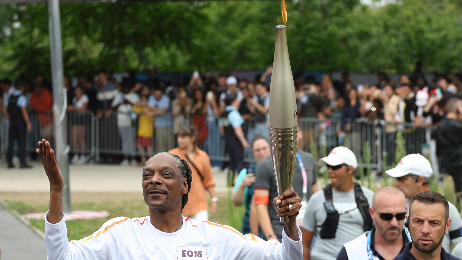 Snoop Dogg carries Olympic flame ahead of Opening Ceremony