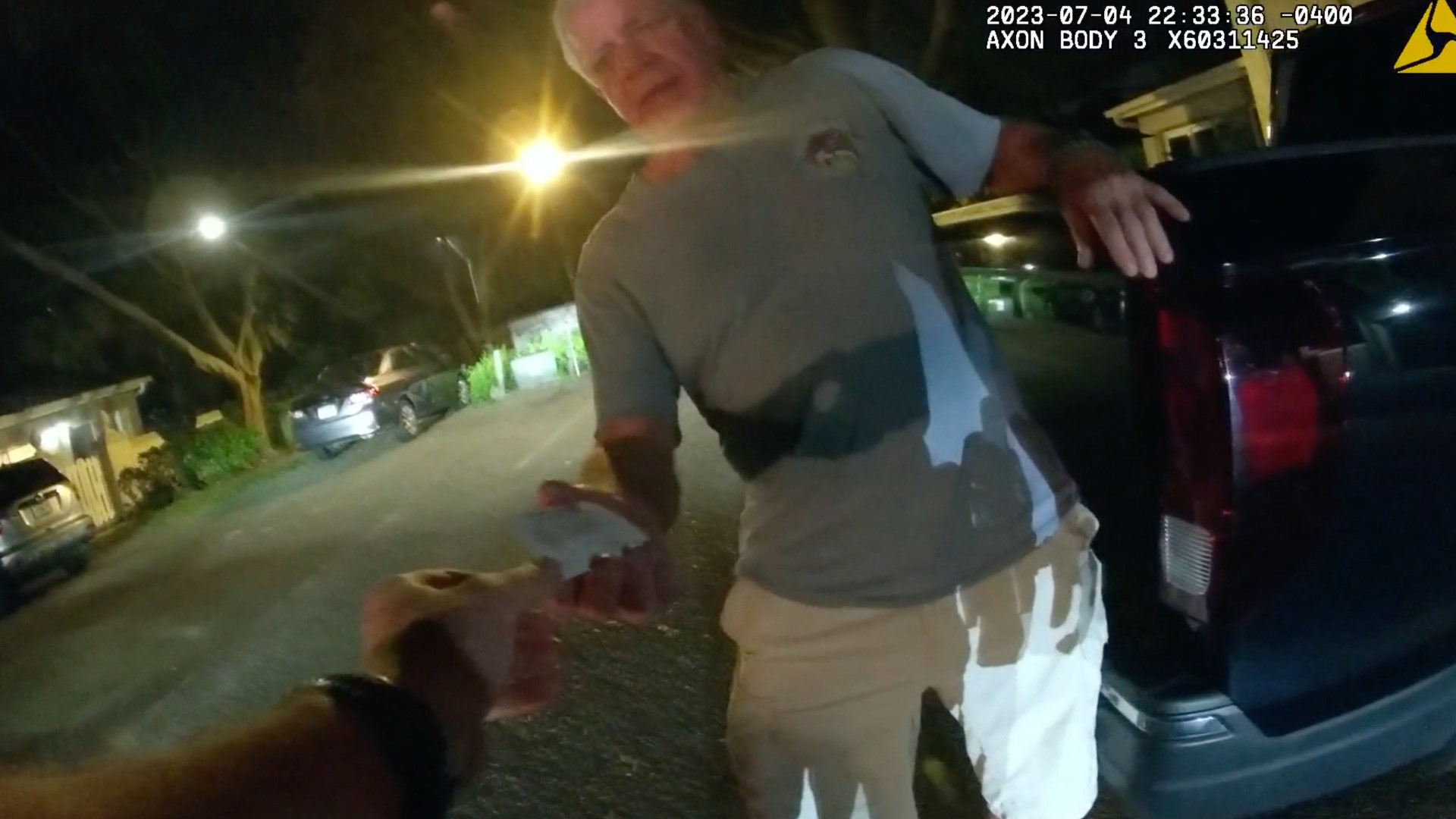 Body-camera video shows a federal prosecutor offering police his card in an apparent attempt to leverage his position to blunt the fallout from a DUI crash arrest.