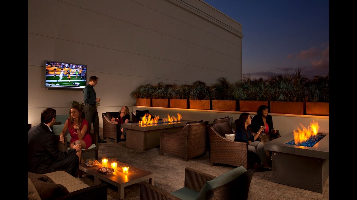 Cozy Fire Pits Lure Guests To Hotels Restaurants And Bars Wltx Com Hilton Orlando S David Club Is A Gastropub The Outdoor Lounge Features Couches Surrounded By Fire Pits And Flat Screen Tvs