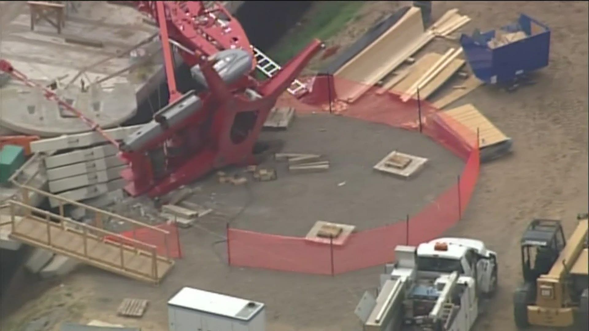 Crane collapse damages building under construction, knocks out power