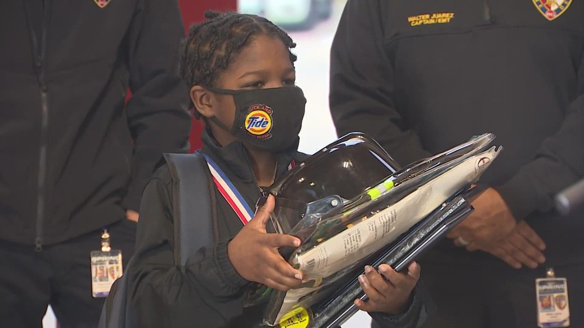 Justin Clayton Jr., 8, woke his parents up when he saw his neighbor's house on fire around 2 a.m. on New Year's Day. He saved precious mementos from being destroyed.