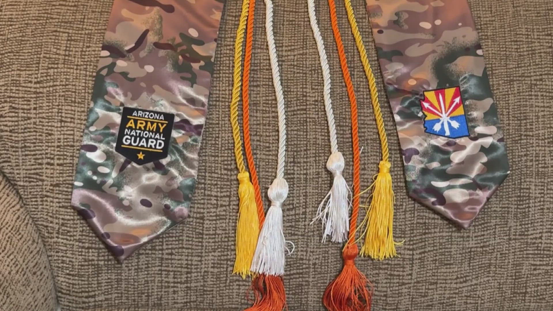 The East Valley district announced Wednesday it was revising policies to formally permit military stoles as graduation attire.