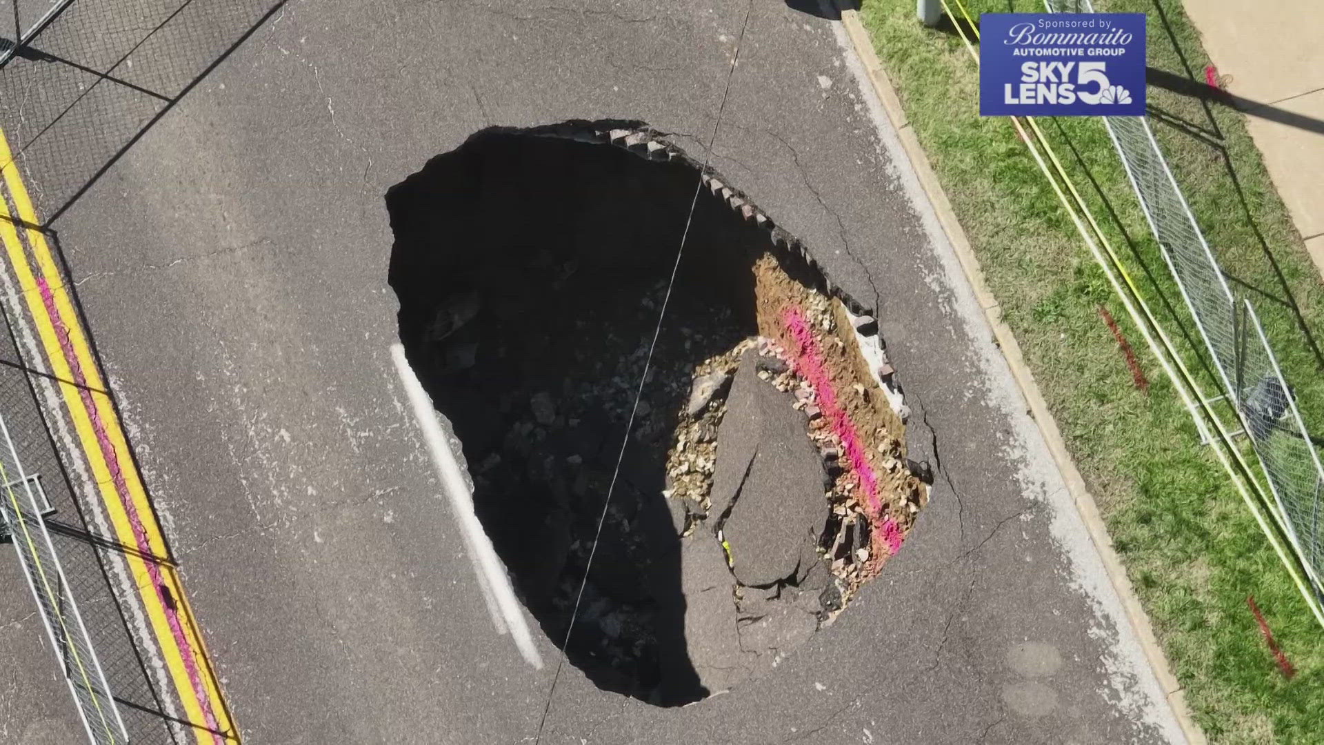 A massive sinkhole that is a sign of St. Louis' problematic infrastructure has caused a street to be blocked off and drew onlookers. 
