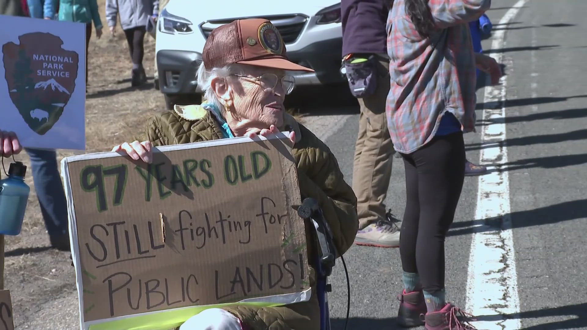 Hundreds of people gathered at the entrance of Rocky Mountain National Park Saturday morning to protest recent layoffs affecting national park employees. 