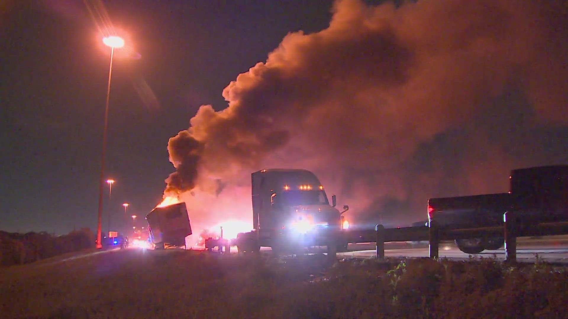 The fire happened on I-30 westbound by Loop 12. Officials tell WFAA the truck was carrying 42,000 pounds of frozen chicken.