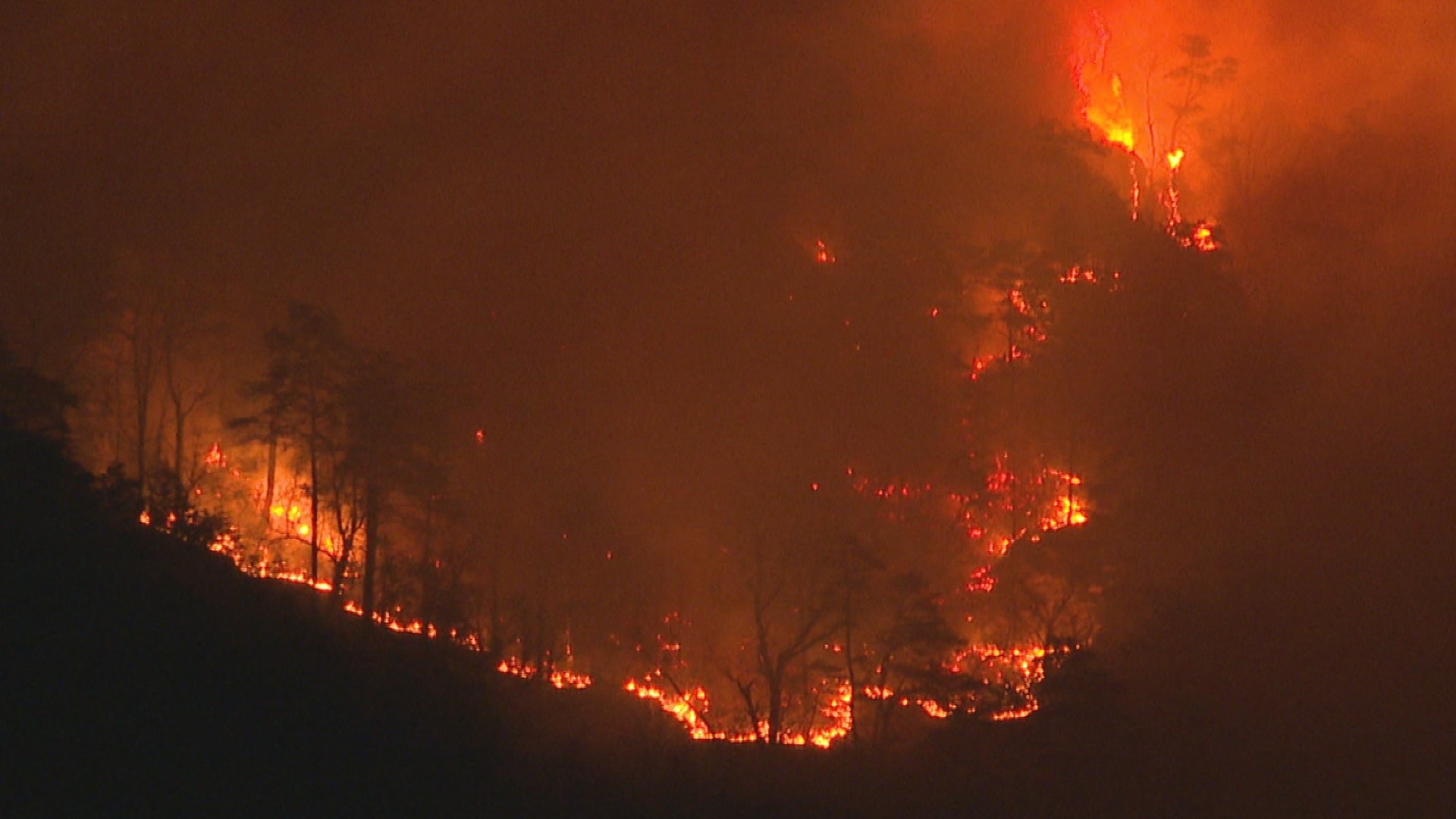 Fire crews are working to put out a huge wildfire on Sauratown Mountain in Stokes County.