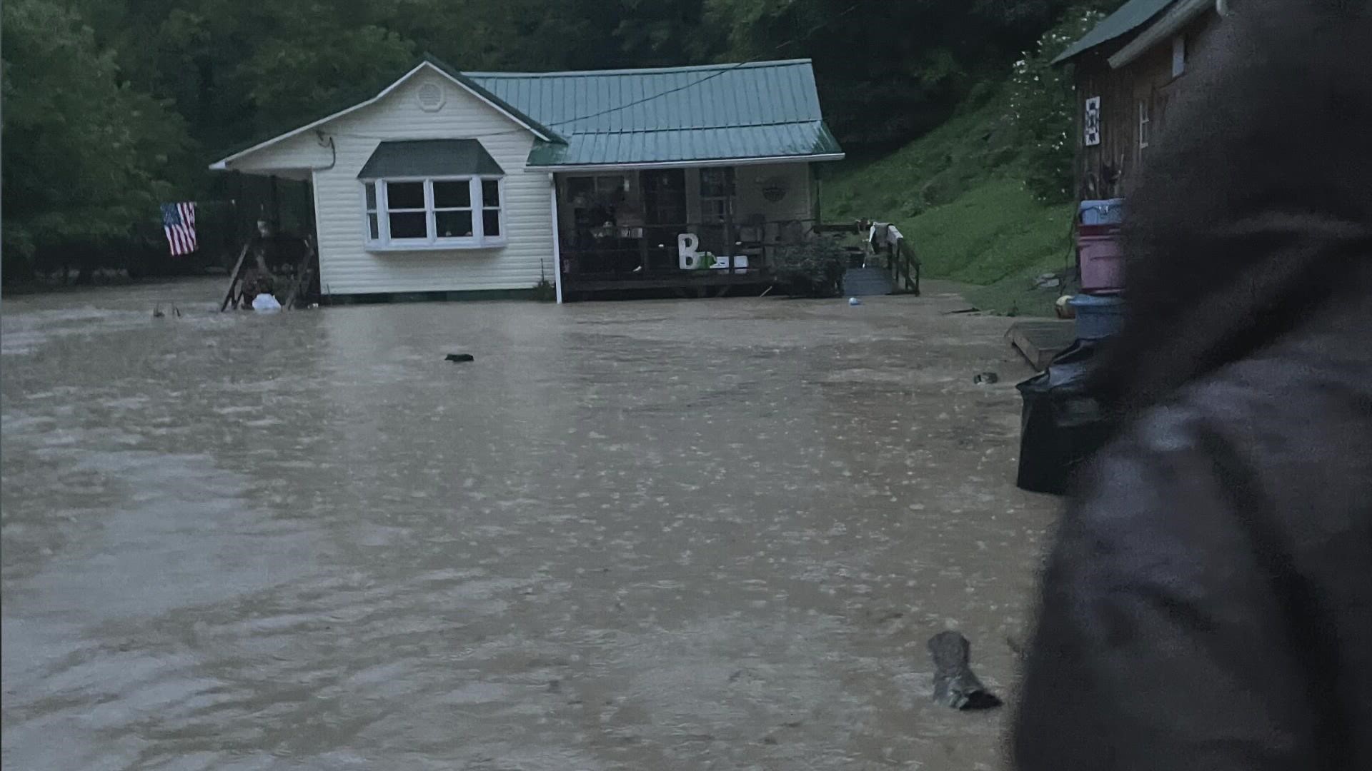 April Back-Stevens said her parent's house is sitting atop a hill, engulfed by flood waters, like an island.