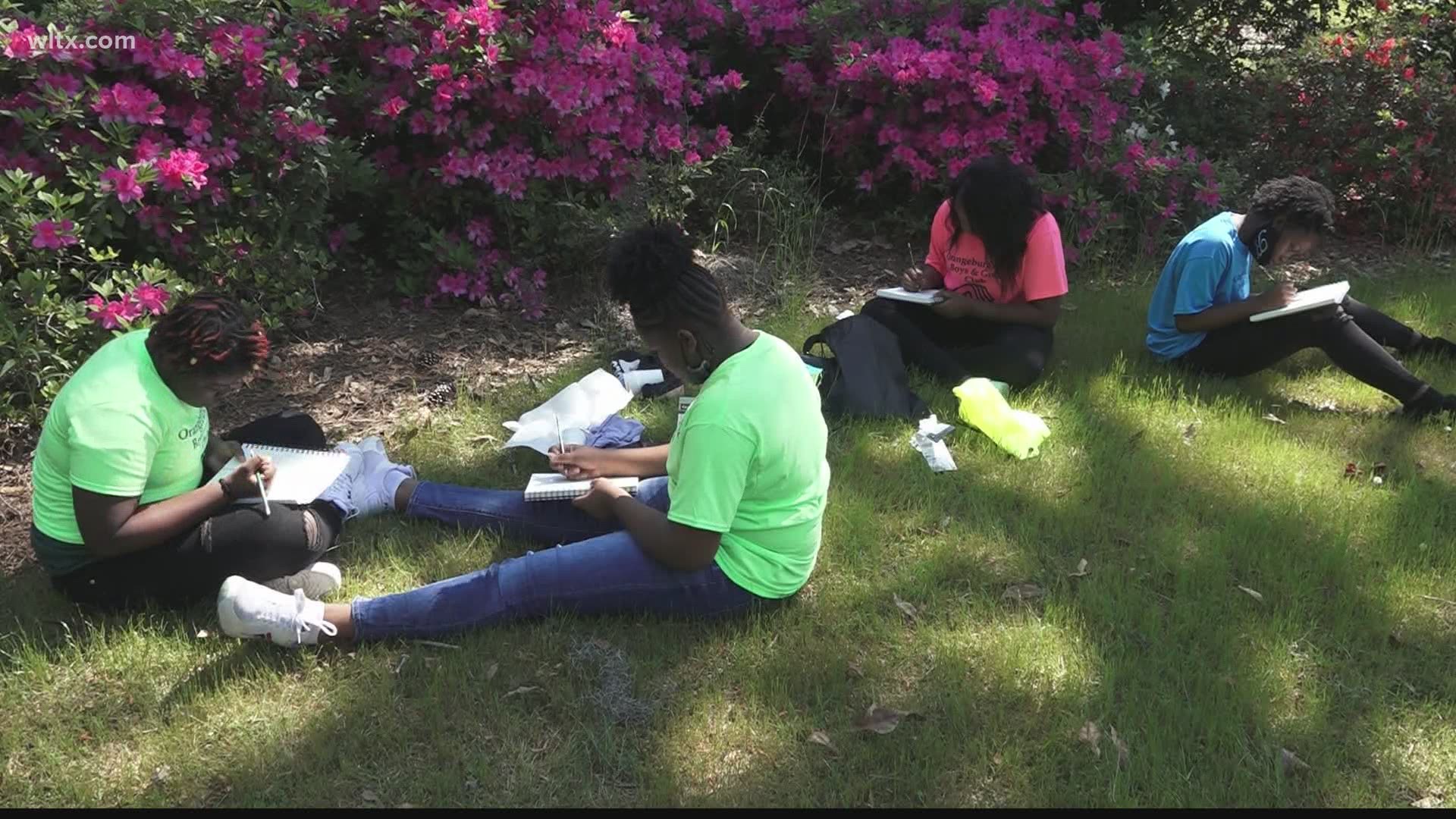 A group of kids from the Orangeburg Girls and Boys club spent the day at Edisto Gardens drawing flowers and enjoying nature.