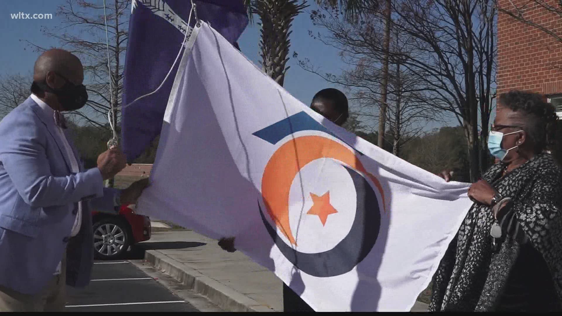 The school district held an unfurling of the new flag on Thursday.