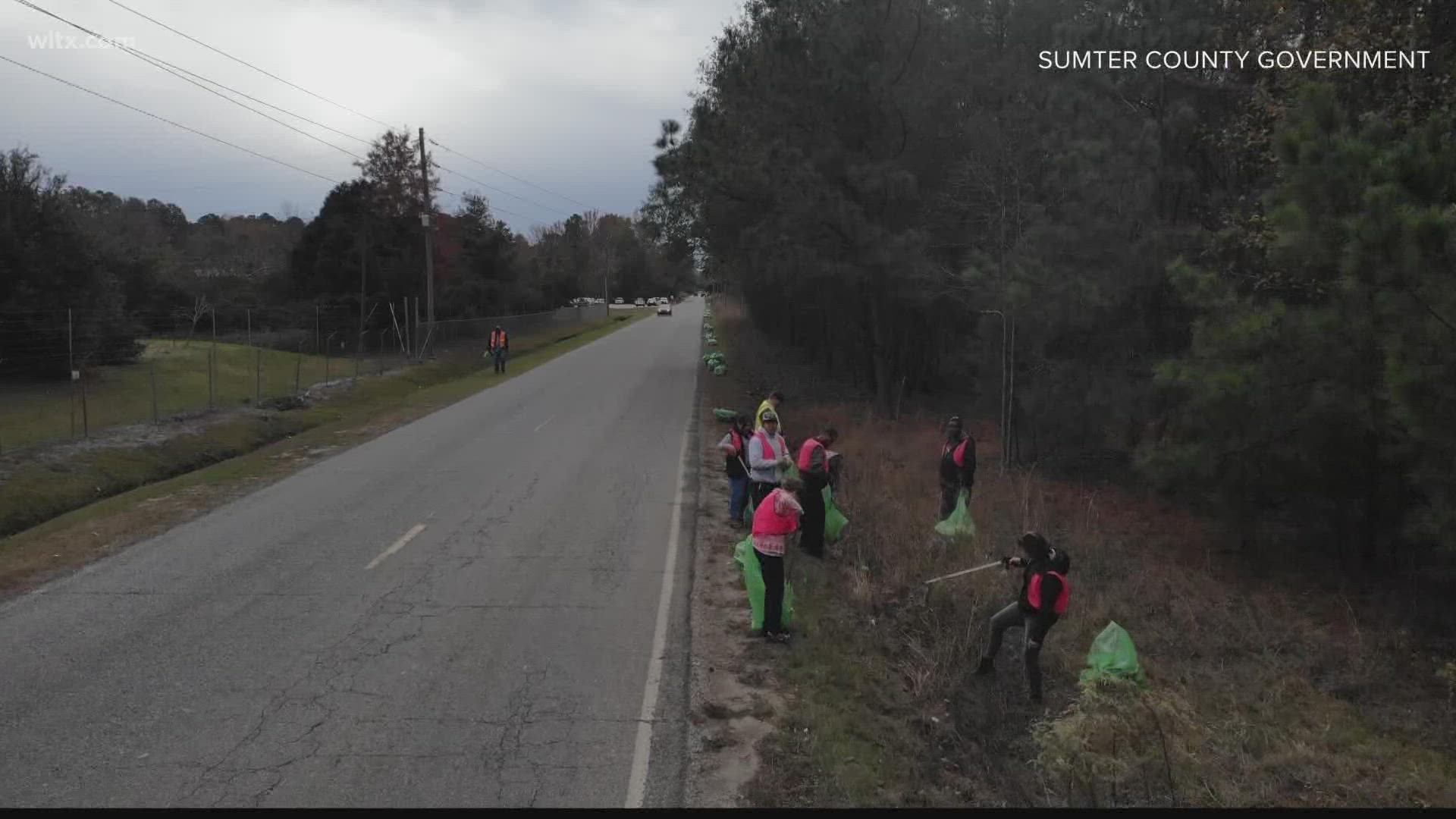 Dozens of employees gathered from 9 a.m. to 11 a.m. to pick up litter along Airport Road and Lafayette Drive for Stash the Trash.