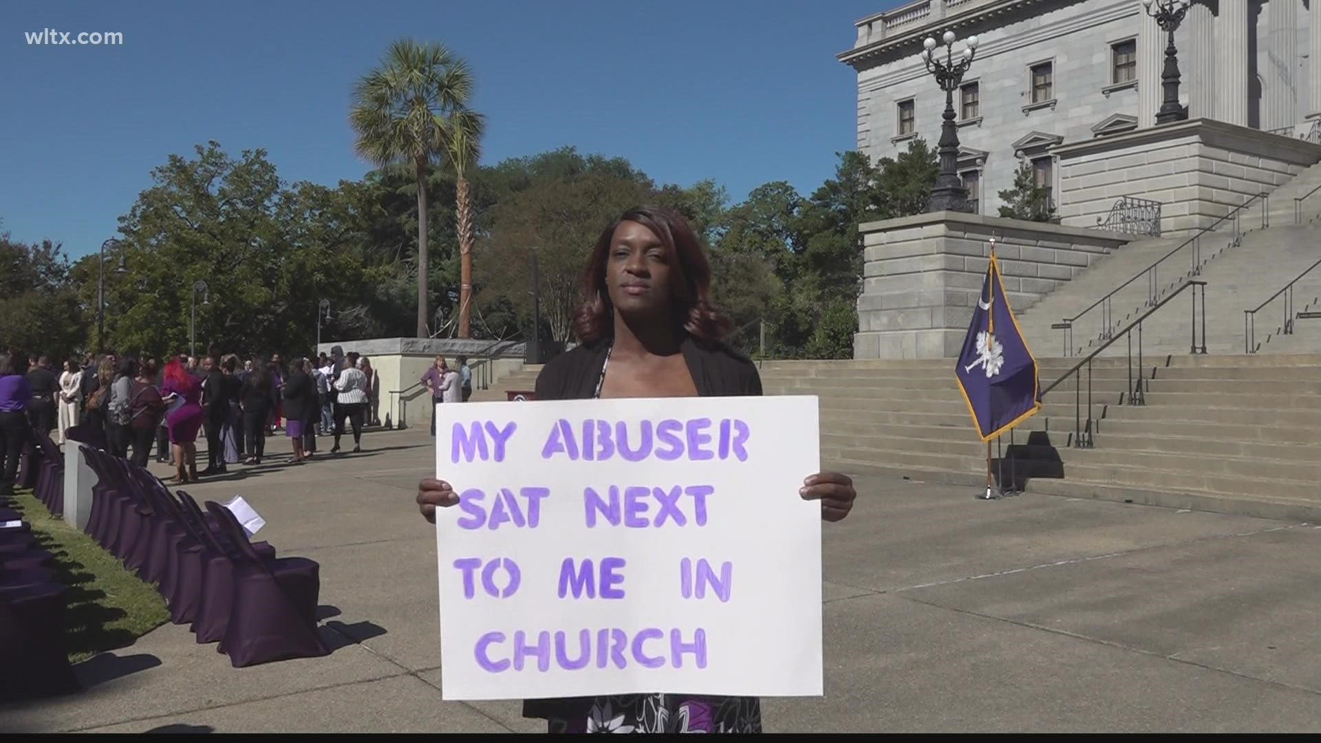 Remembering victims of domestic violence on the lawn of the State House Tuesday morning.
