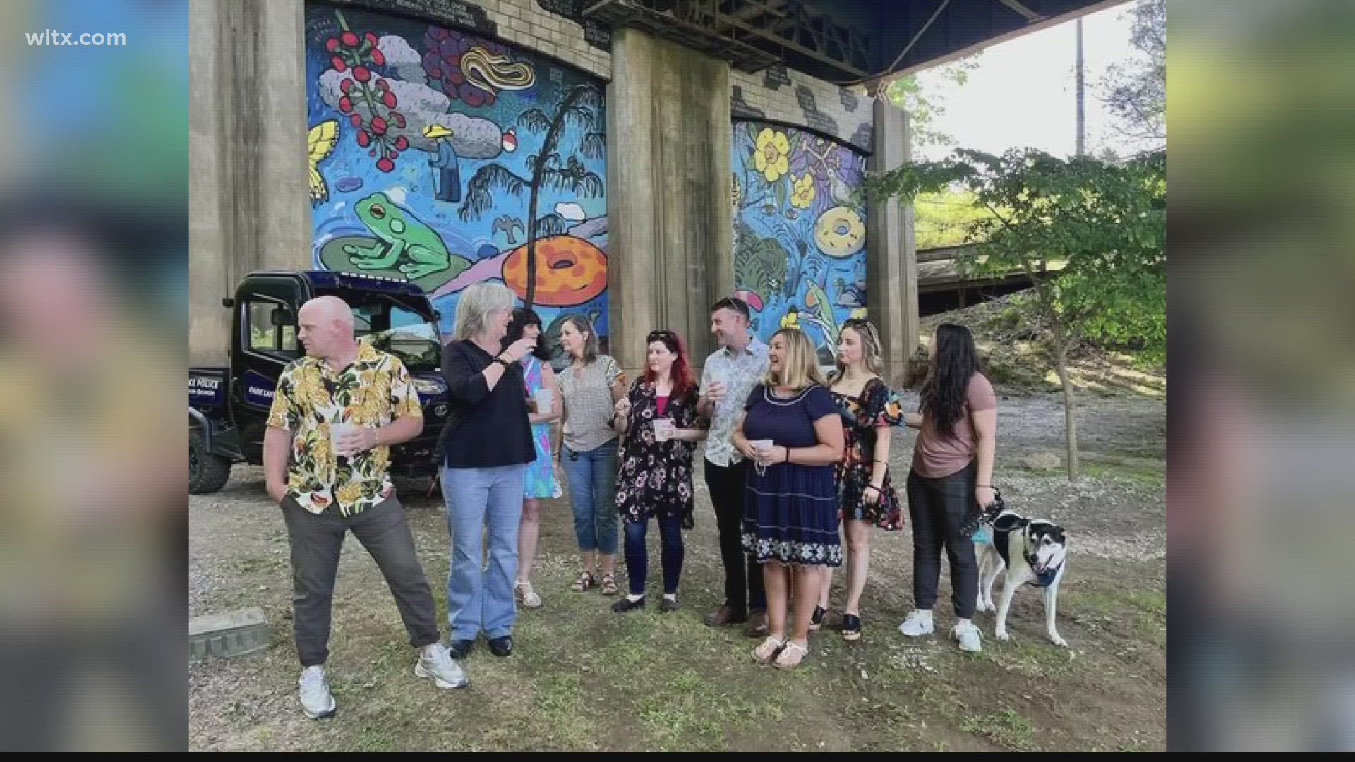 The large painting under the Blossom Street Bridge took artist Joel Cothren six weeks to complete.