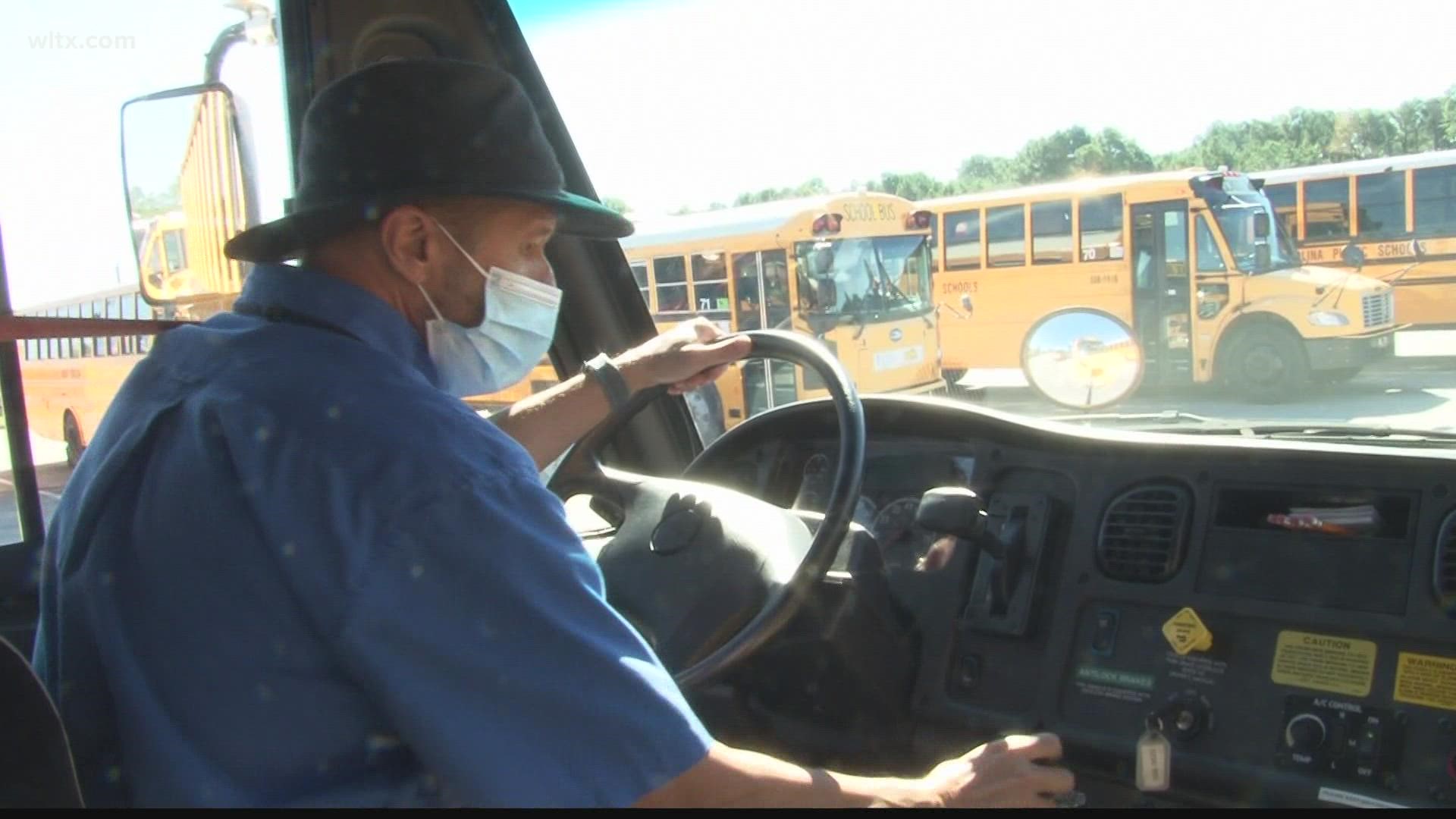 Some school bus drivers in the Midlands are having to drive extra routes and wait times are increasing.