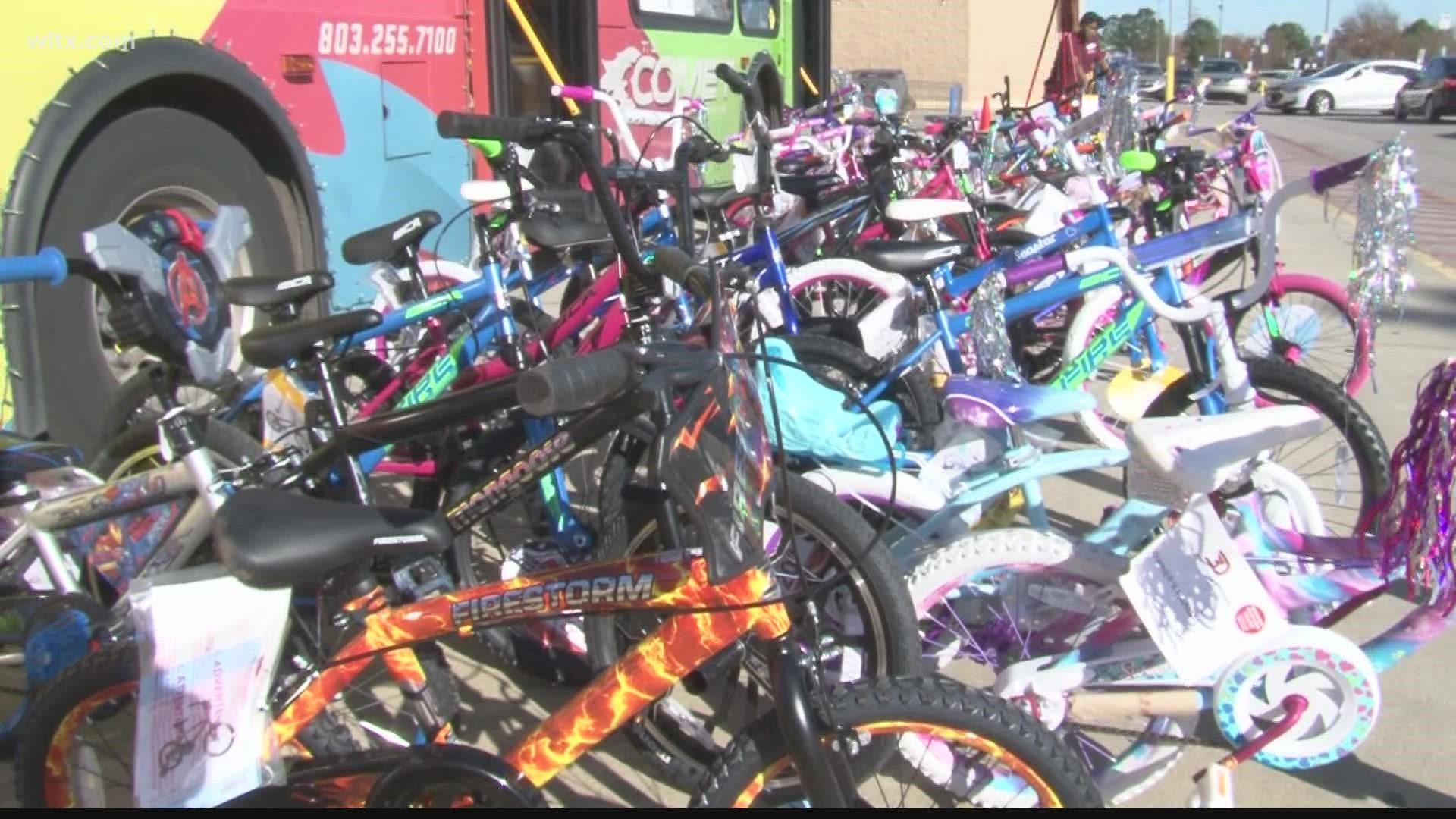 The Full Moon Club went to the Walmart in Lexington to donate dozens of bicycles to kids.