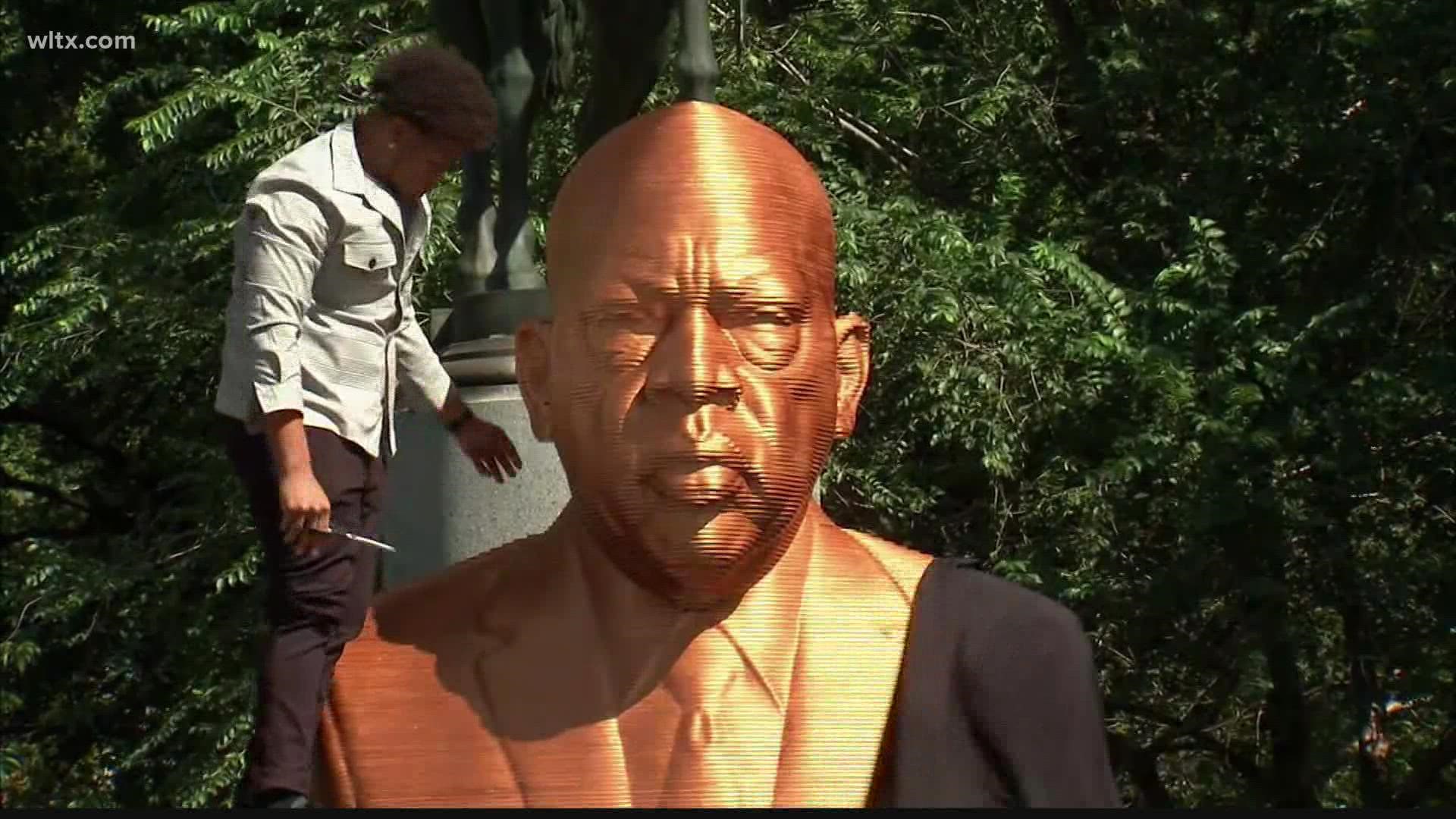 Made of wood, the new Brookland statues demand social justice and include, George Floyd, Breonna Taylor, and John Lewis. They were unveiled on Thursday.