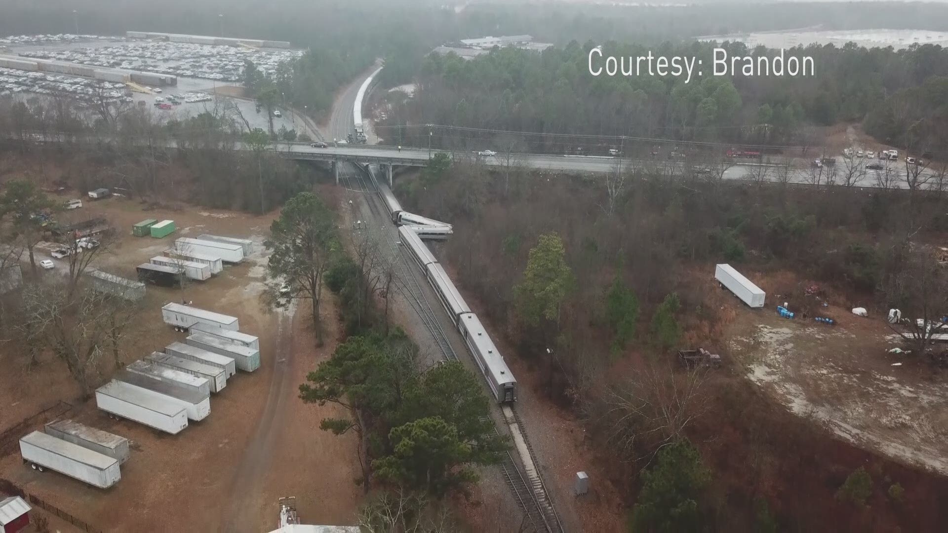 Drone video shows the extent of the damage caused after an Amtrak train collided with a freight train.