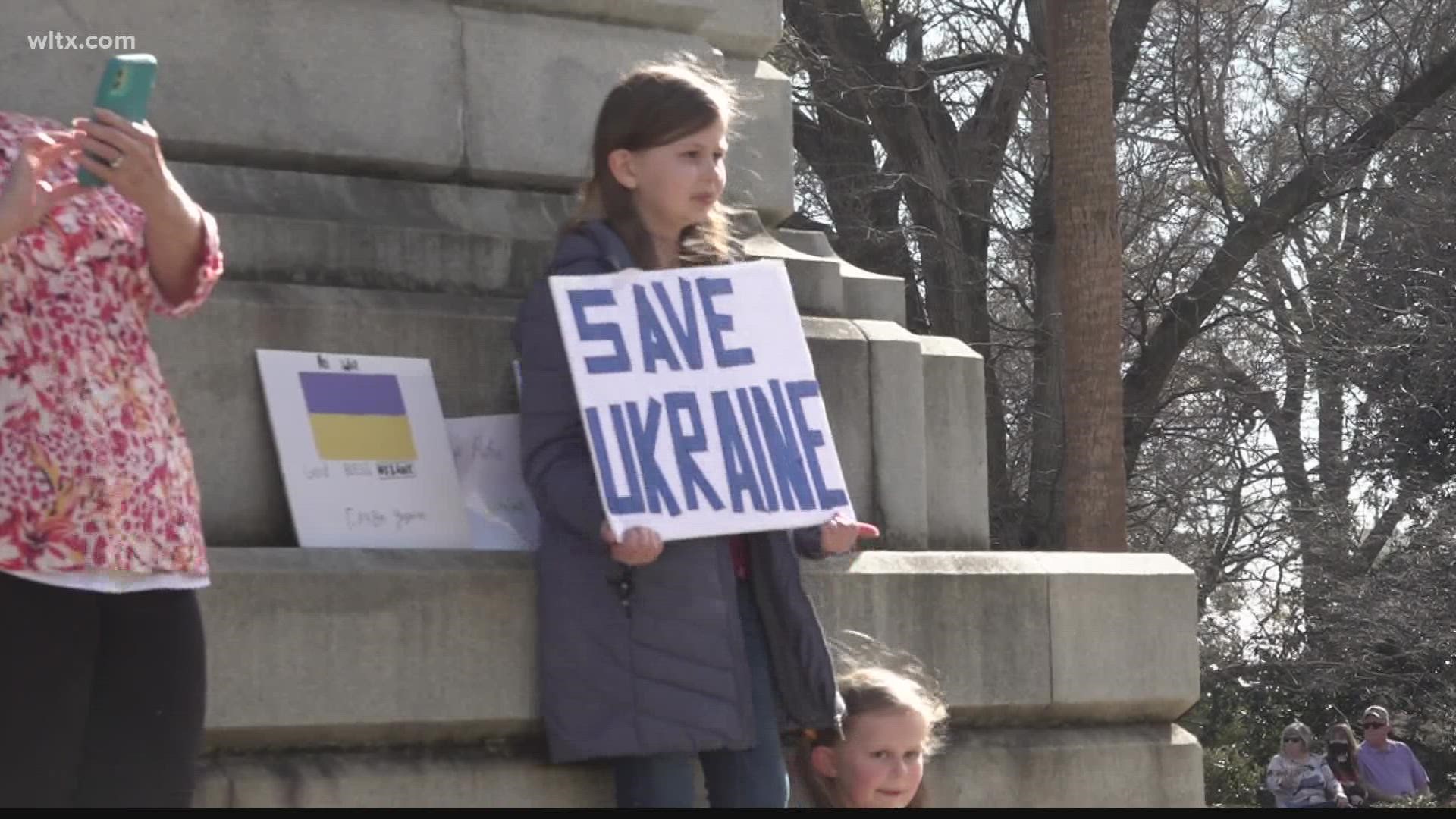 Dozens of people filled the State House grounds in support of Ukraine while hoping to spread a message to 'Stop War'