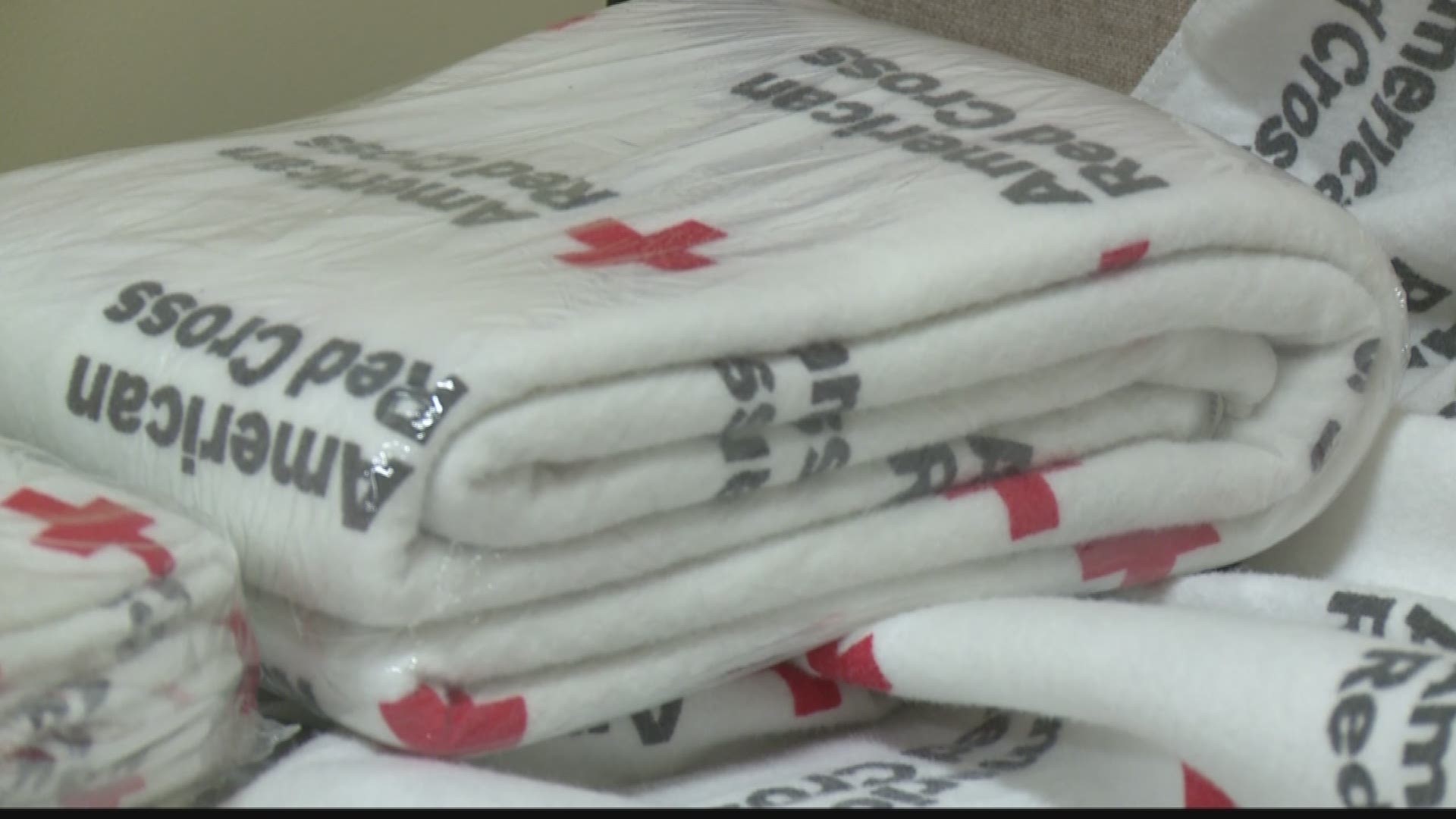 Talking with Red Cross volunteers as they get shelters ready 