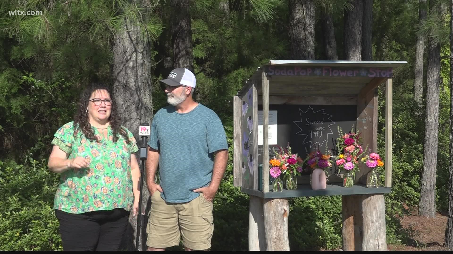 The two Holly Hill residents created the flower stop in an effort to bring some light during dark times and pandemic.