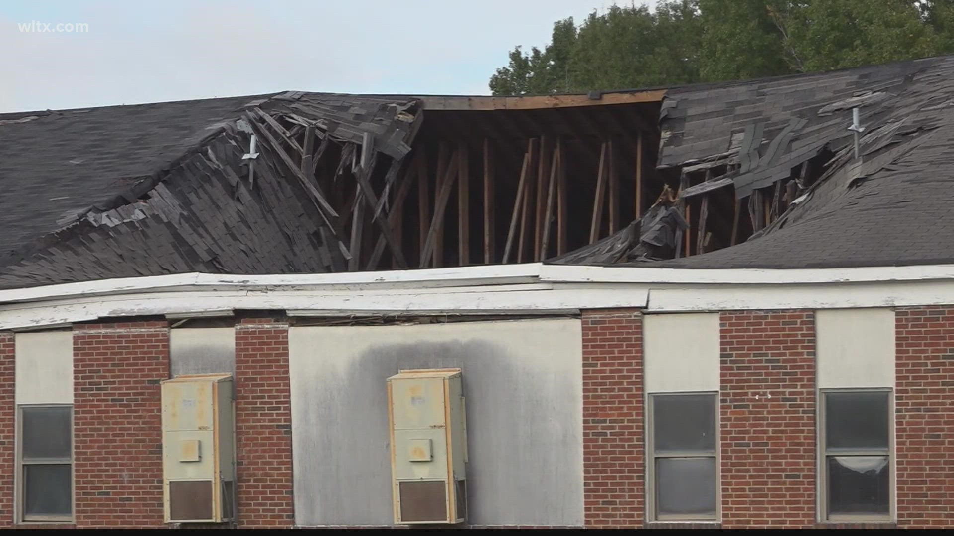Superintendent of Lee County School District Bernard McDaniel's talks about the gaping hole in the roof Dennis Elementary School.