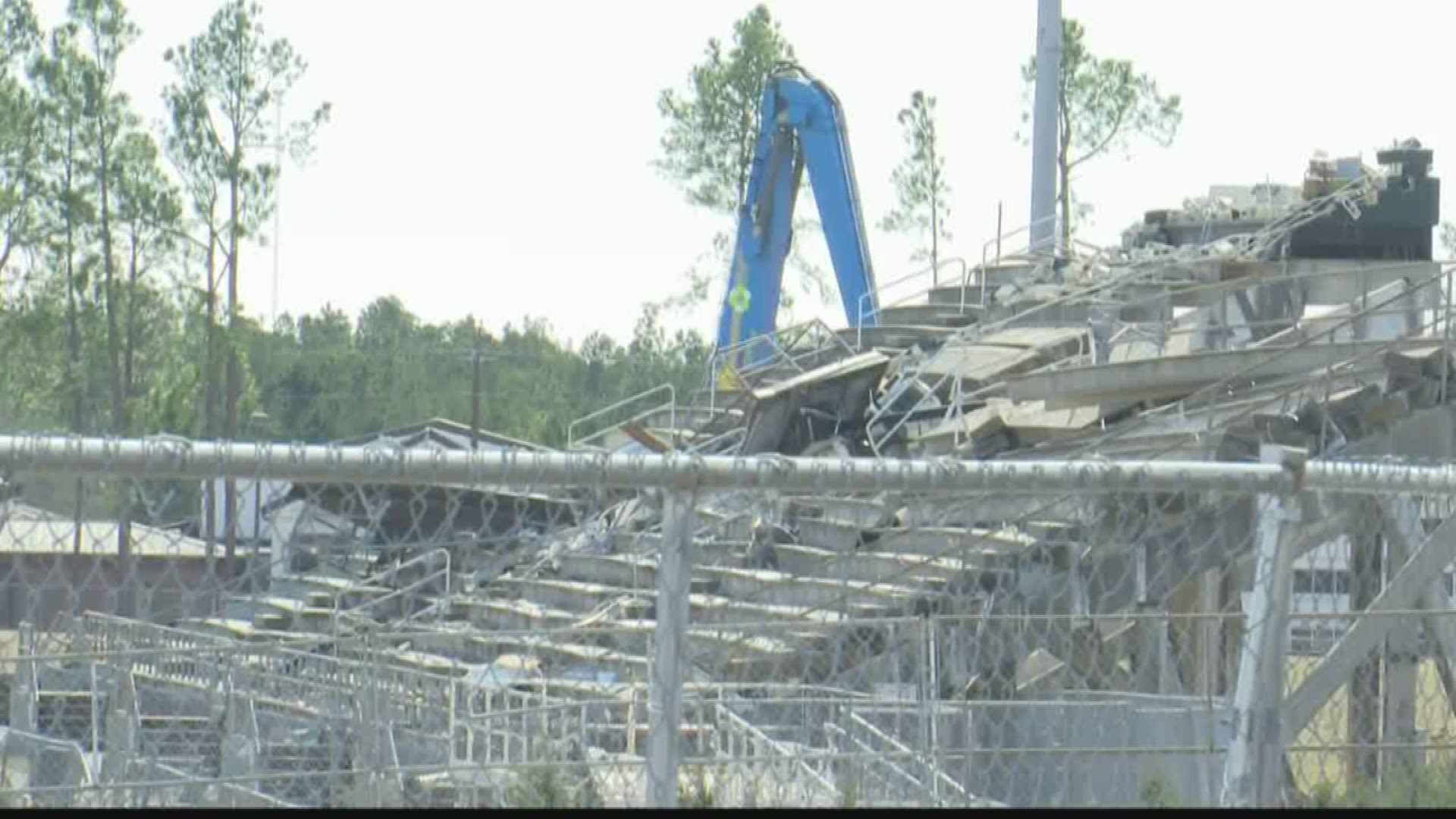 Crews have started to demolish part of North Central High School's football stadium after a tornado damaged it and parts of the school.