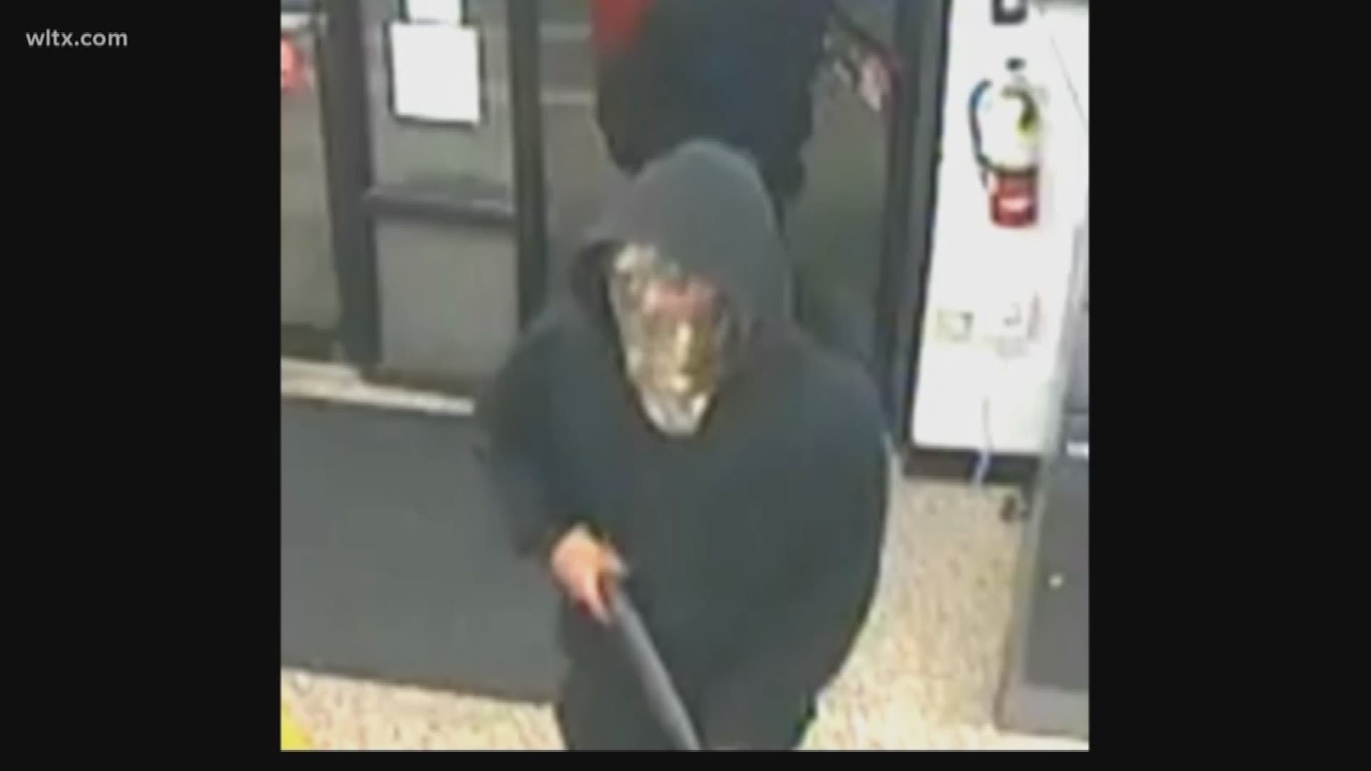 A store clerk said two suspects entered the store dressed in black with pull-over hoodies AND One of the suspects was armed with a shotgun.	The subjects forced the store clerk to the register and then fled the scene with an unknown amount of cash.