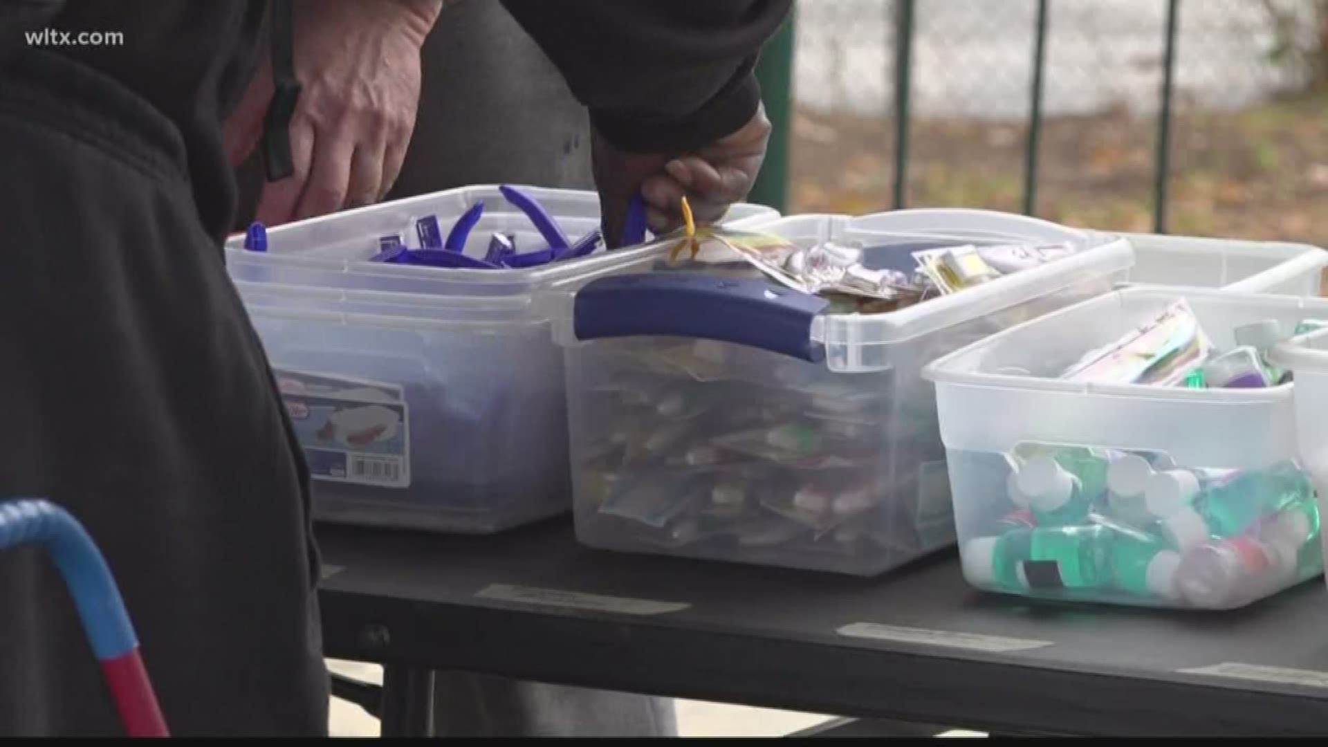 Every third Sunday, homeless men and women line up at Finlay Park to receive things they need.