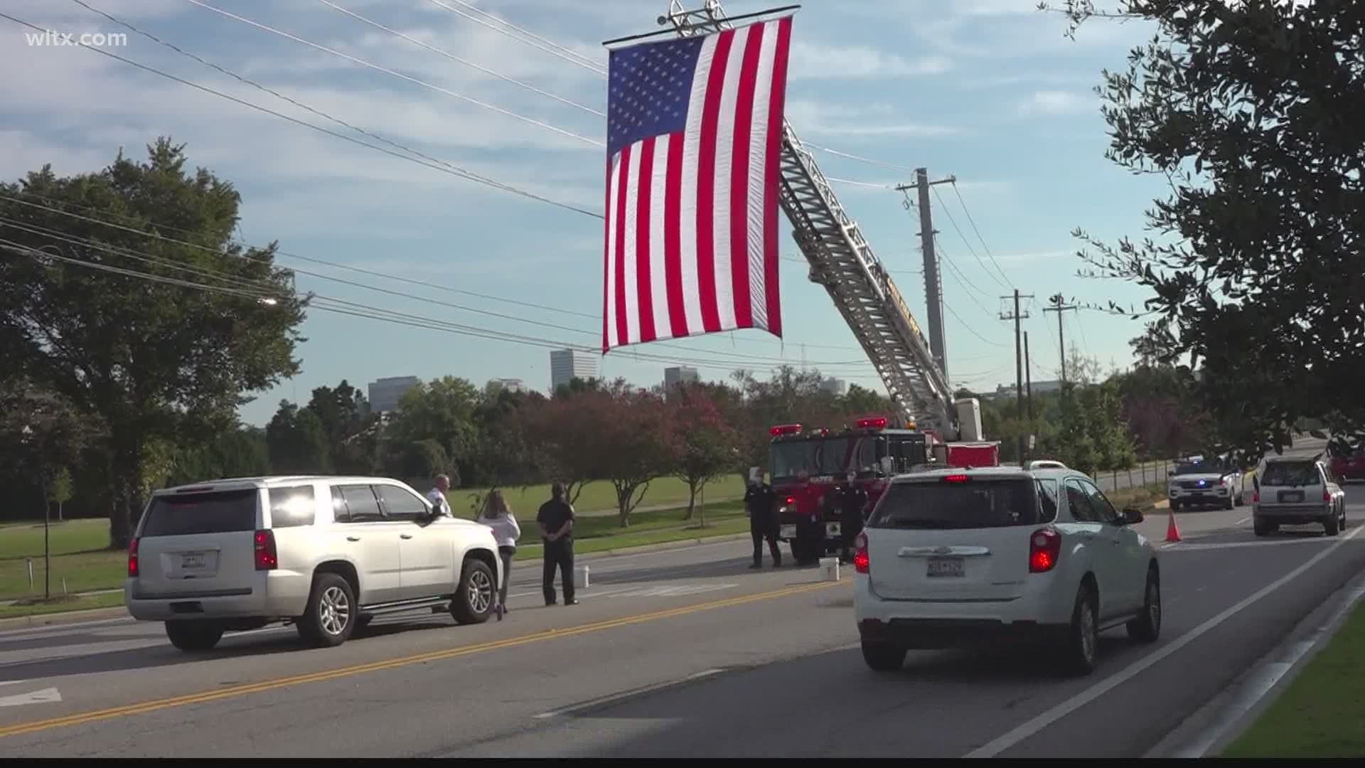The city of Cayce raised a giant American flag using fire trucks in remembrance of those who died on September 11, 2001.