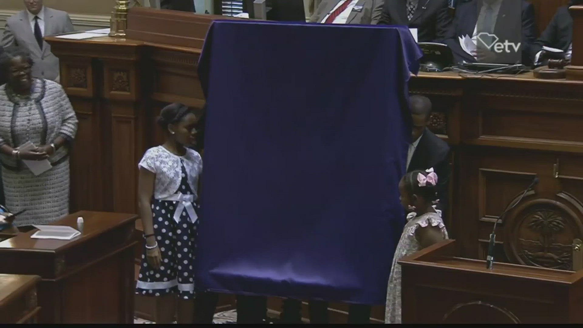 Sen. Clementa Pinckney's daughters unveiled his official portrait at the South Carolina Senate.