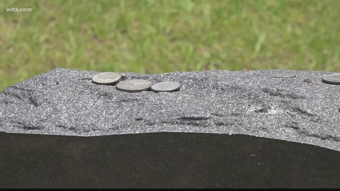 Coins on military headstones and what it means