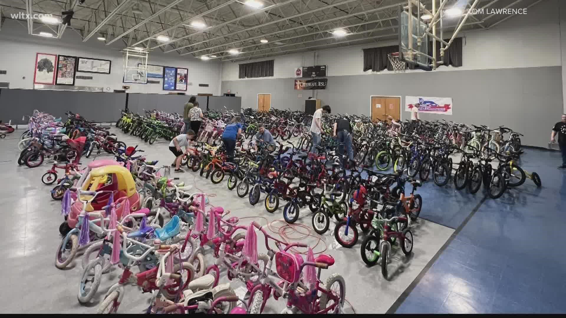 Tom Lawrence repairs bicycles year-round to give children at Christmas.