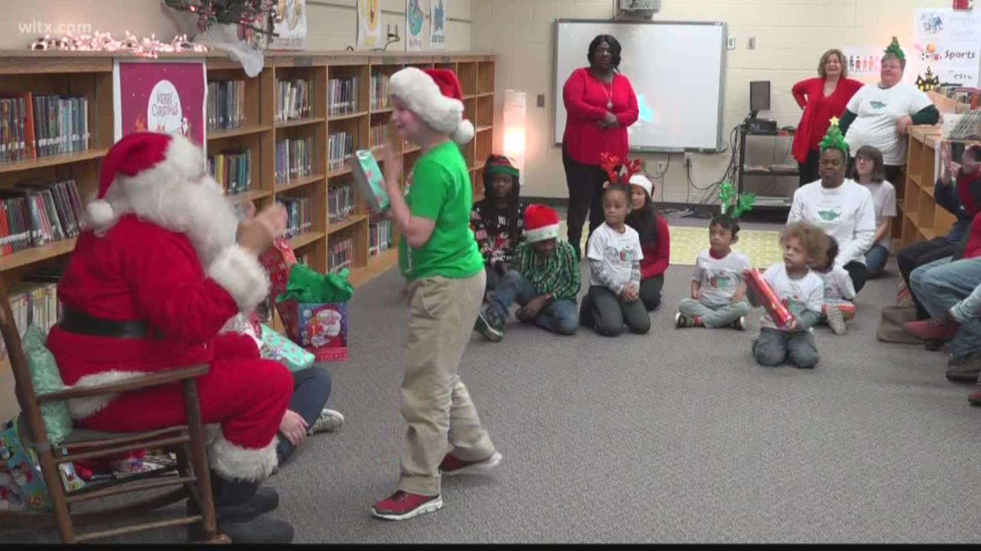 Each student gets a toy and the opportunity to interact with Santa