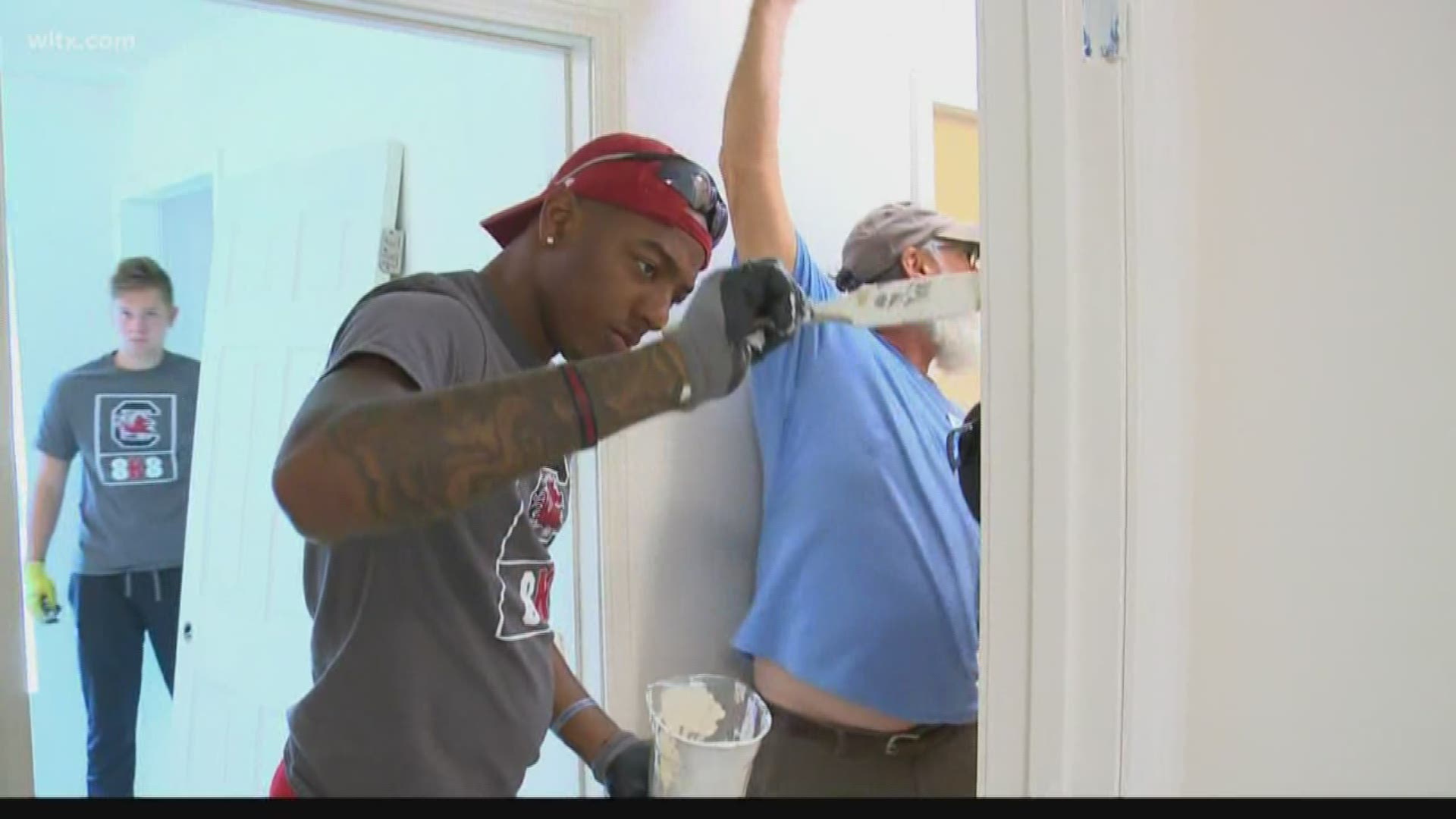 Saturday, the guys were helping put the finishing touches on one of the houses built by Habitat for Humanity.