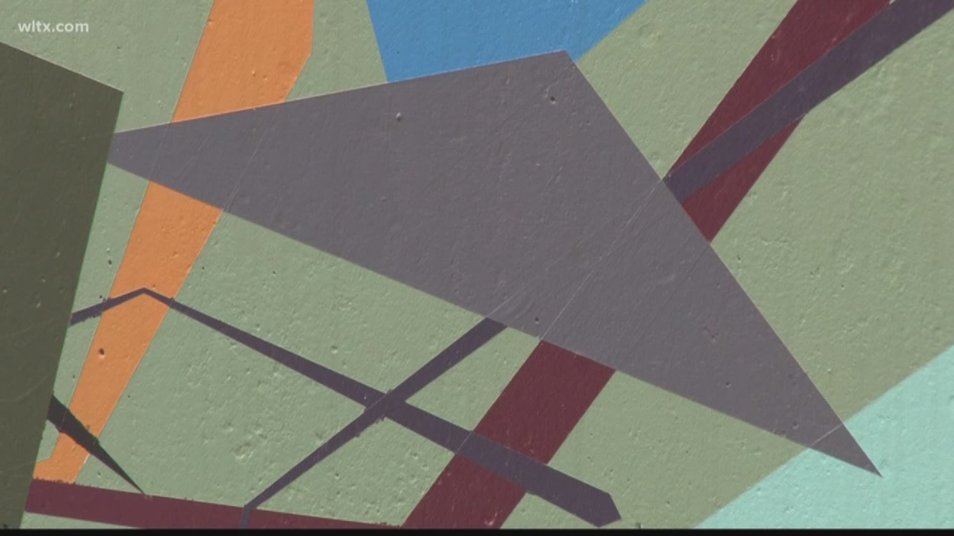 A local artist is hoping his mural will "make you feel good"