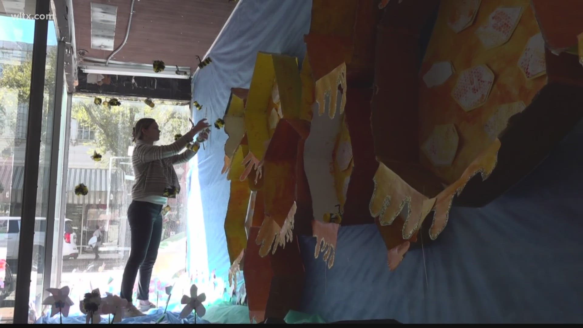 Art teachers, students and artists have begun decorating windows in businesses throughout downtown Sumter for Saturday's Walk of Art as part of the Inspire Festival.