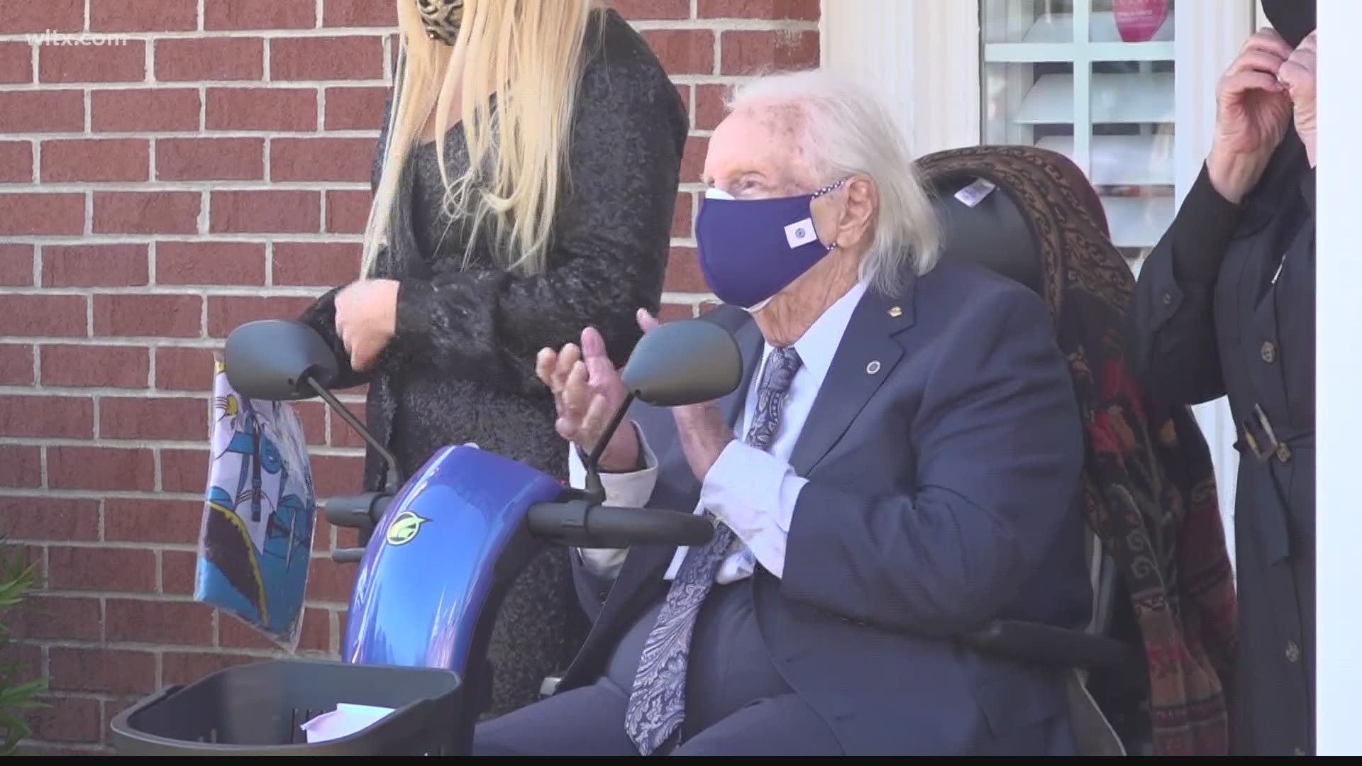 Algie Walker was greeted by friends and family in a drive-thru parade on his 94th birthday.