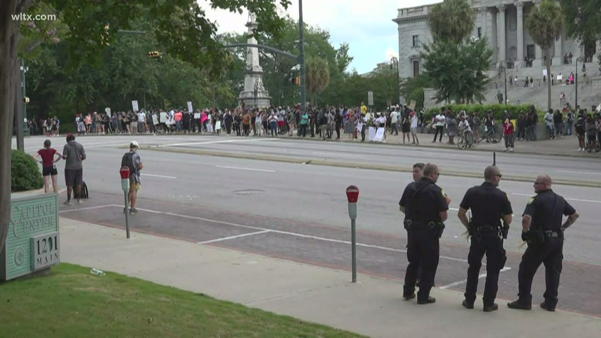 After being met by law enforcement near the police headquarters, protesters have moved back to State House.
