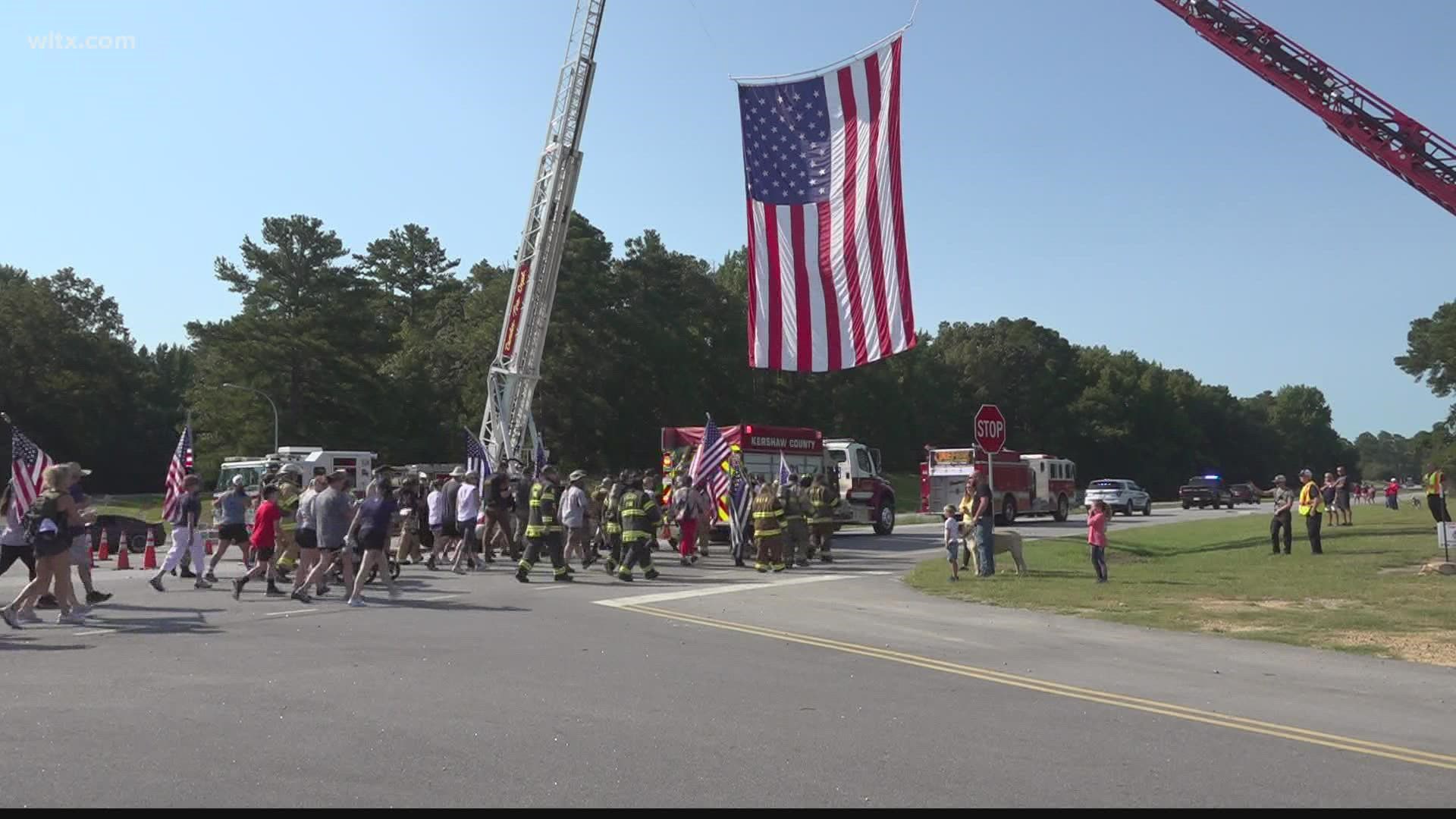 First responders and community members began their walk at the Camden Fire Department and finished five miles away at the Lugoff Fire Department.