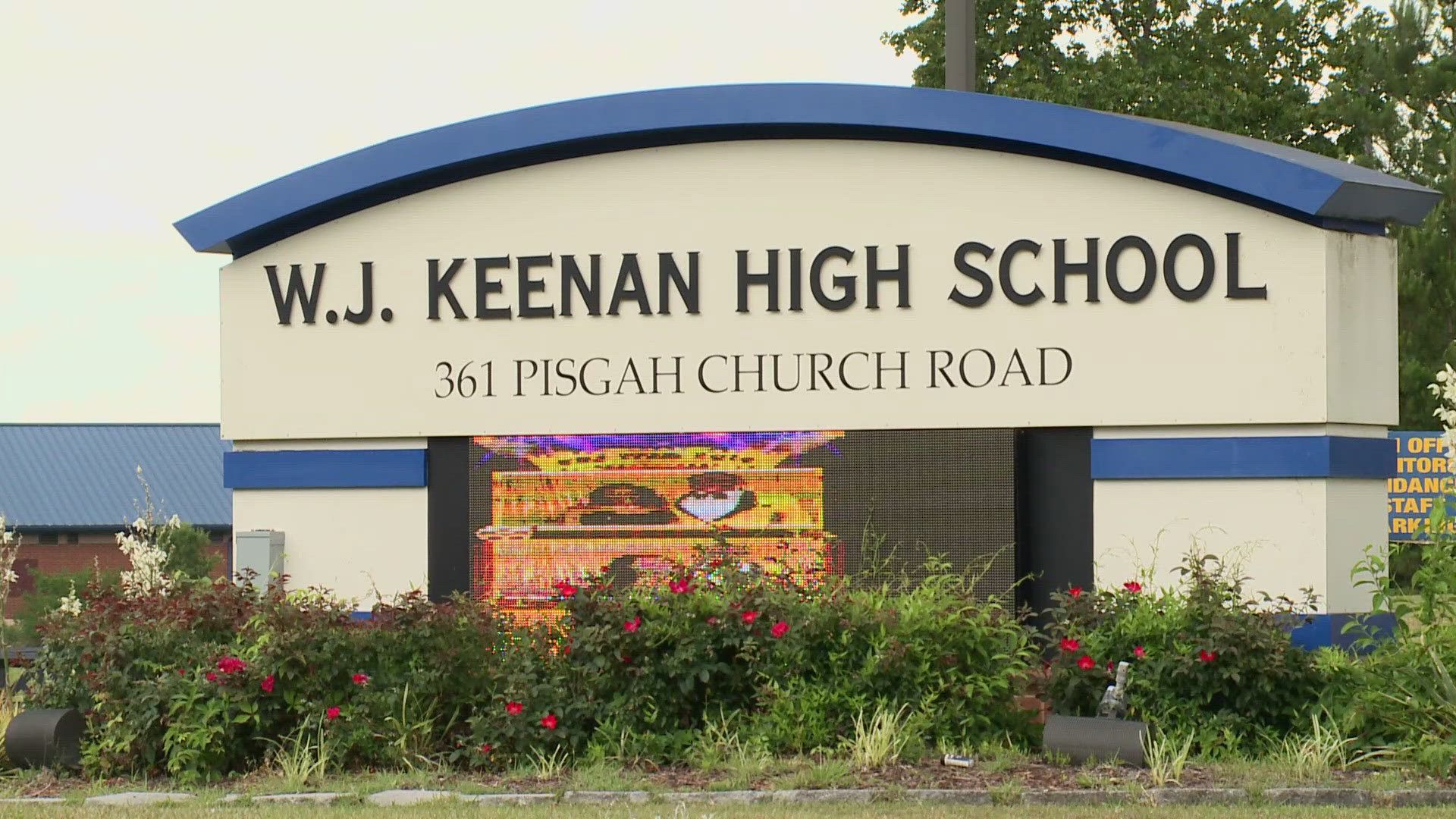 The woman was found with a gun in her purse after setting off a metal detector at the front door of Keenan High School.