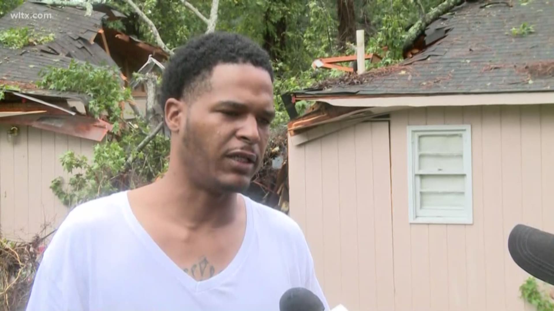 A tree fell on a Columbia home during Tropical Storm Michael, trapping someone inside the house.