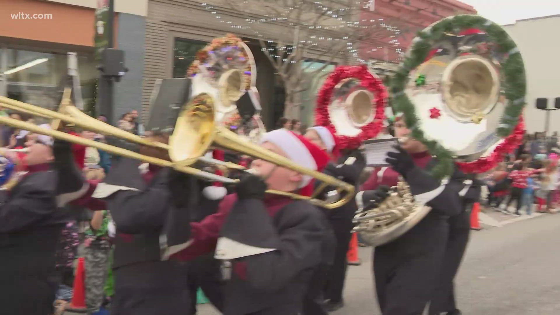 Downtown Lexington's Christmas parade featured schools, bands, and festive cheer as crowds lined Main Street for this annual December tradition.