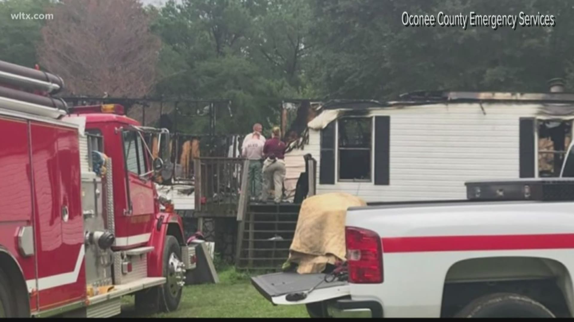 Authorities say a man and the grandson who was trying to rescue him have died in a house fire in northern South Carolina.