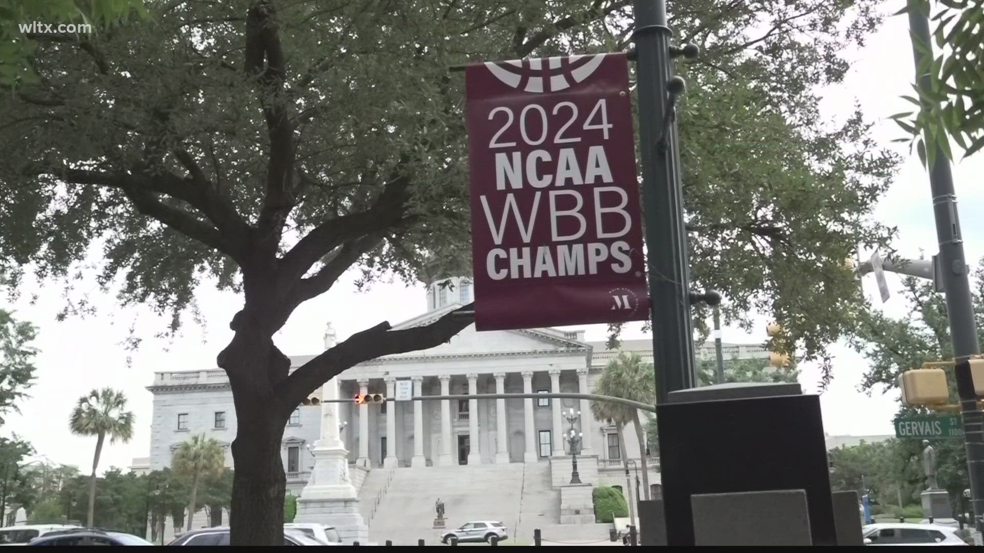 The banners, which hang on the light posts on Main Street, celebrate the USC women's basketball win, but some folks want them for themselves.