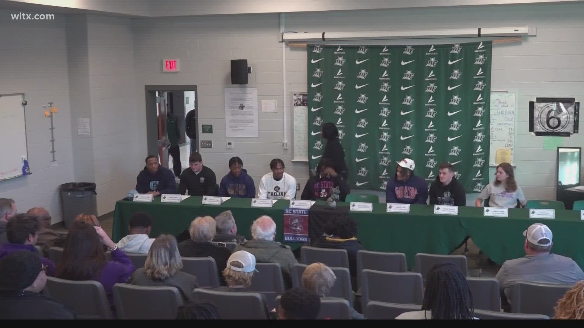 On National Signing Day, athletes from Dutch Fork, White Knoll and Irmo donned the gear of their college choice while posing for pictures with family and friends.