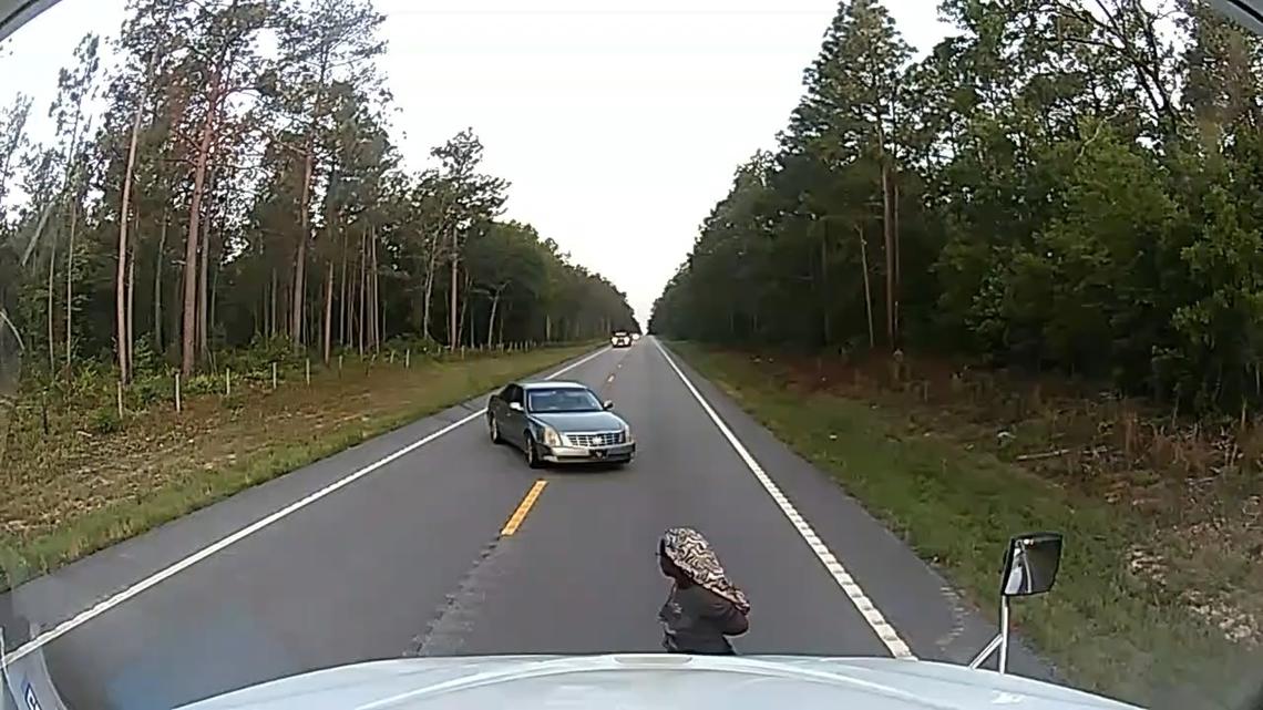 A handcuffed woman ran into a trucker's path in South Carolina. He says God put him there