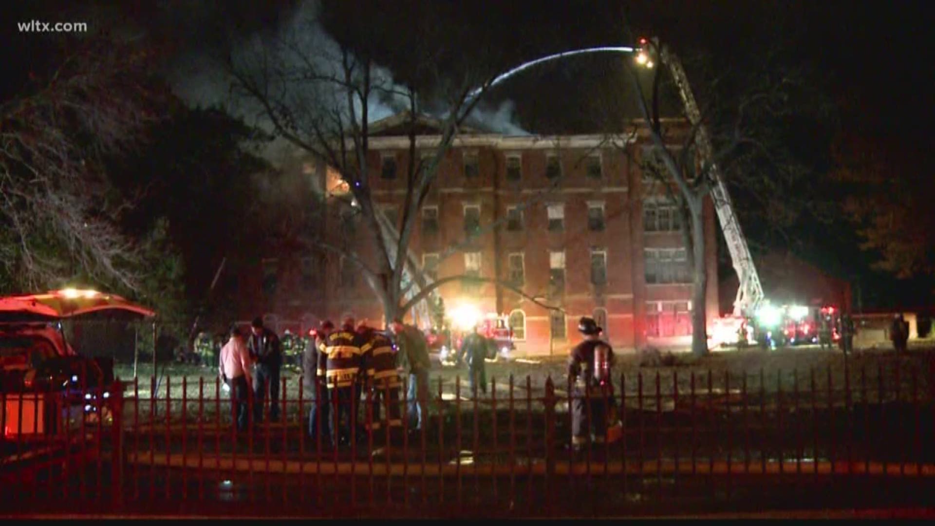 Columbia fire fighters work on fighting fire at the historic Babcock building